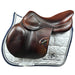 Amerigo CC Jumping saddle in brown leather saddle on a white quilted saddle pad with 'Polished Saddles' branding.