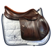 Polished Saddles 17.5 inch brown leather Equipe EKGO special jumping saddle with medium knee rolls on a white saddle pad.
