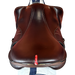 Polished Saddles brown leather 17.5 inch Equipe EKGO special jumping saddle with white stitching and red accent.